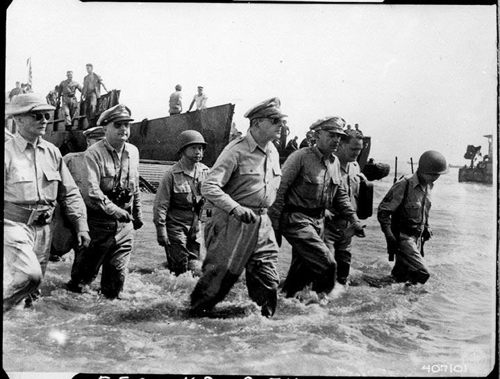 Black and white photo of general McCarthor landing on the beach.