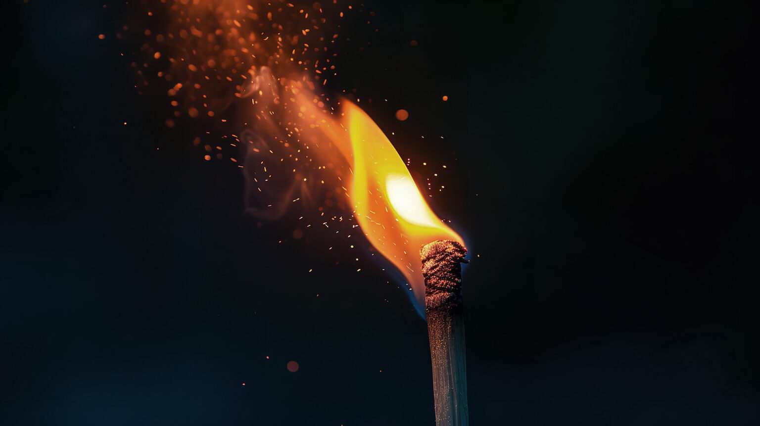 Photo of a match being lit.